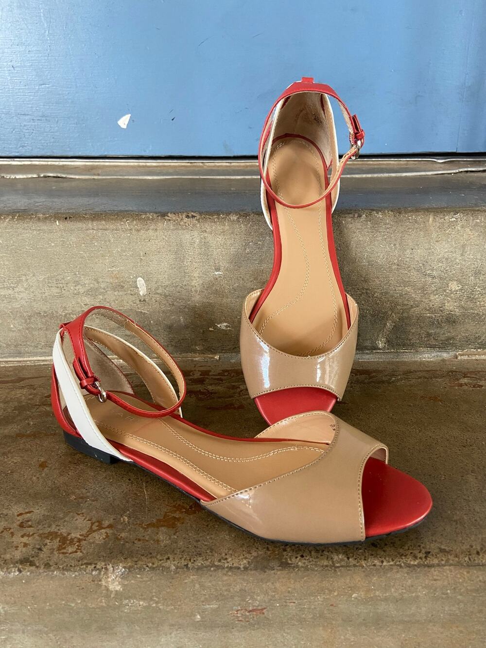 Tahari Fleur peep toe ankle strap flat sandals in tan, dark orange, and white